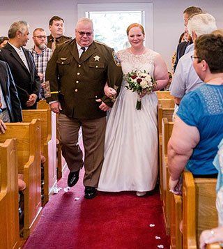 Sarah walking down aisle